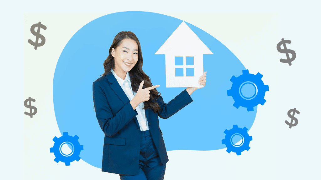 A woman in a suit pointing at a cutout of a house