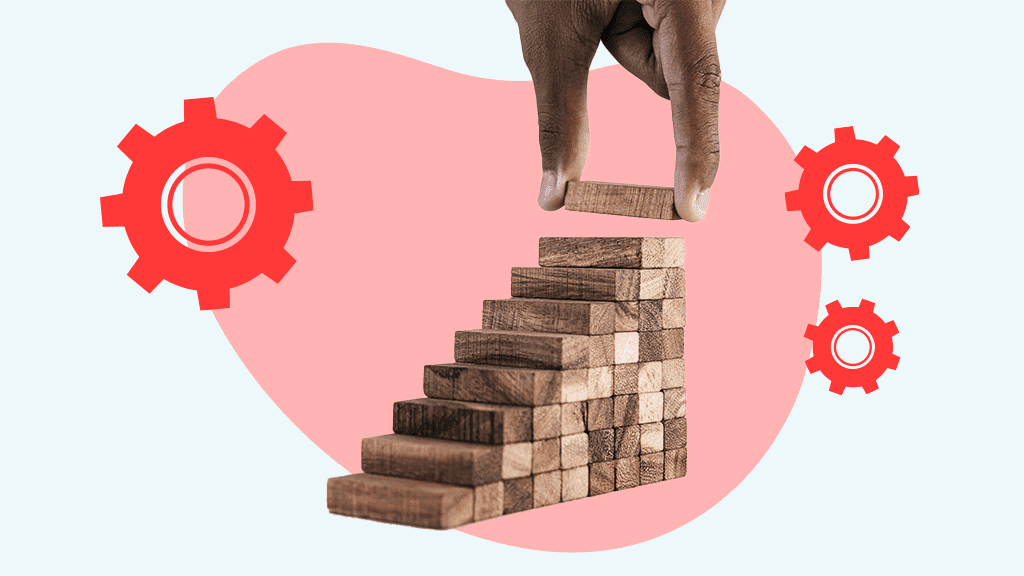 A hand stacking jenga blocks like stairs